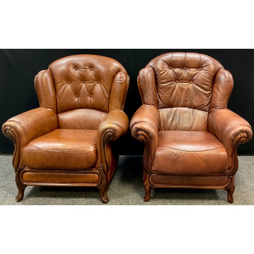 60 - A pair of tan leatherette button-back armchairs, 100cm high x 89cm wide, (2).