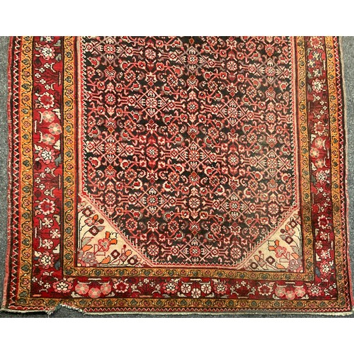 87 - A Persian Bidjar rug, hand-knotted with a central diamond-shaped medallion with stylised flowers, wi... 