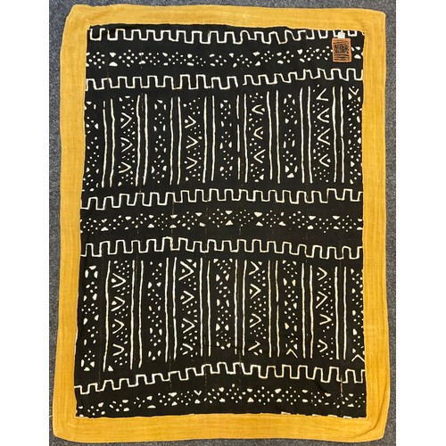 89 - A Moroccan Kuba throw / rug, hand-stitched and dyed fabric panels, with rows of abstract designs in ... 