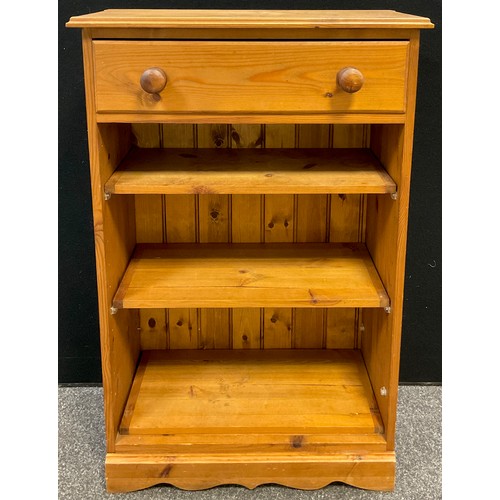 92 - A pine bookcase, single long drawer to frieze, three tiers of shelving, 101.5cm high x 66cm wide x 3... 