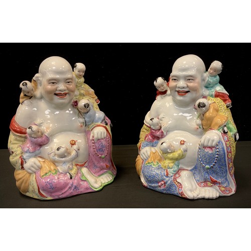 103 - A pair of Chinese porcelain figures, each as Hoti and children, 25cm high (2)