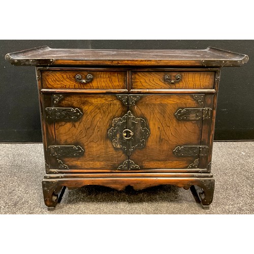 104 - A Chinese elm and hardwood side cabinet / altar table, pair of short drawers to frieze, cupboard doo... 