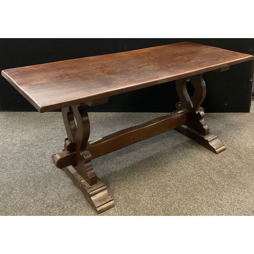 114 - A mid 20th century solid oak trestle refectory / dining table, probably by Frank Pratt of Derby, thi... 