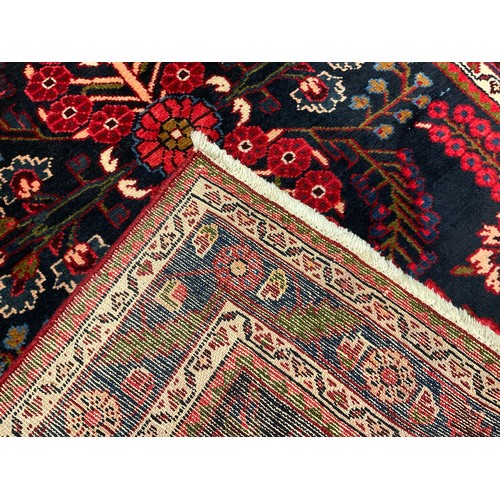 118 - A North West Persian Rudbar runner carpet, hand-knotted with a central field of three repeating flor... 