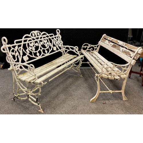 156 - An early to mid 20th century cast iron garden bench, the back and sides cast as entwined fruiting vi... 