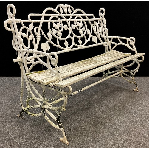 156 - An early to mid 20th century cast iron garden bench, the back and sides cast as entwined fruiting vi... 