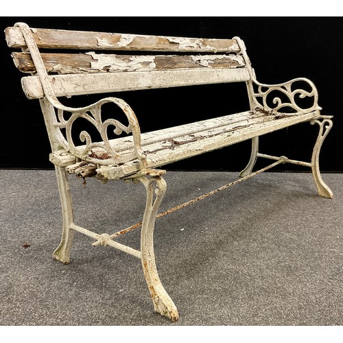 156 - An early to mid 20th century cast iron garden bench, the back and sides cast as entwined fruiting vi... 