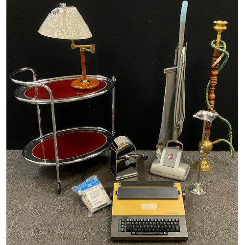 165 - A 1970’s chromed metal and glass tea trolley;  adjustable table lamp;  Brother electronic typewriter... 