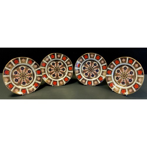 172 - A set of four Royal Crown Derby, 1128 pattern plates, 22cm diameter, all firsts.