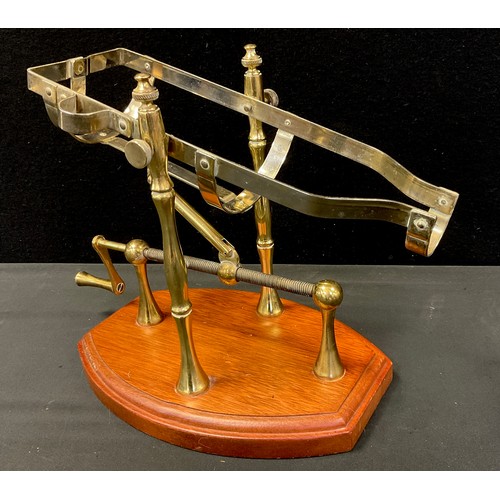 70 - A mechanical action wine bottle decanting cradle, 20th century.