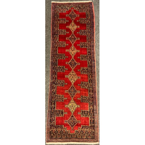 300 - A North West Persian Senneh runner carpet, 255cm x 78cm.