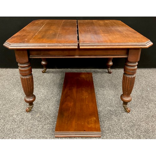 308 - A Victorian extending walnut dining table, canted square top, extending to rectangle with addition o... 