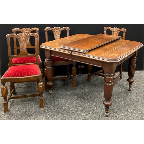 308 - A Victorian extending walnut dining table, canted square top, extending to rectangle with addition o... 