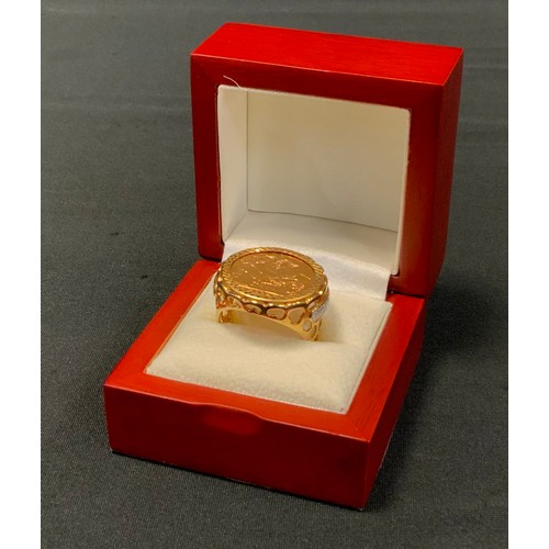 430 - A diamond mounted sovereign signet ring, 2003, London mint, 9ct gold shank, size U/V, 13.7g gross, b... 