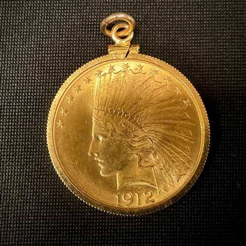 431 - Coins & Tokens - a United States of America ten Dollar gold coloured metal coin, Indian Head beneath... 