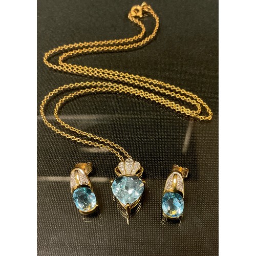 444 - A diamond and blue topaz pendant necklace and earring suite, 9ct gold mounts, stamped 375, 6.3g gros... 