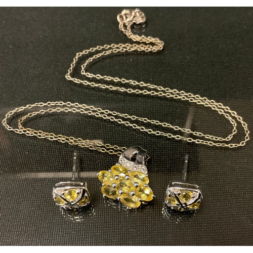 445 - A diamond and yellow beryl pendant and earring suite, 9ct white gold mounts, stamped 375, 4.1g gross... 