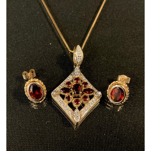 448 - A diamond and garnet pendant necklace and earring suite, 9ct gold mounts, stamped 375, 4.6g gross