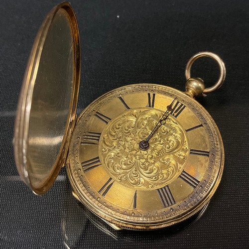 453 - A Continental yellow metal cased open face pocket watch, gilt floral dial, Roman numerals, key wind ... 