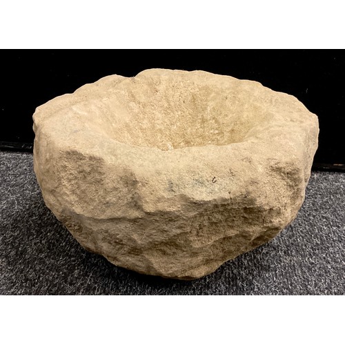 309A - A Derbyshire stone crucible shaped bowl, trough, 16cm high x 29cm.