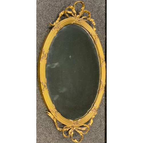 119 - A Victorian oval gilt framed looking glass wall mirror, ribbon swag and cross detailing,  78cm x 47c... 