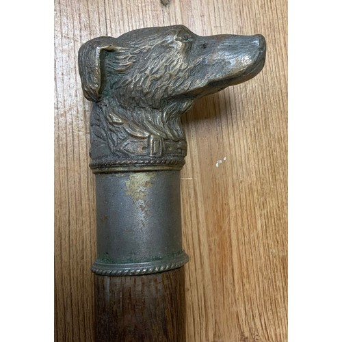 35 - A 20th century dogs head walking stick, cast metal handle as a Terrier, tapering shaft, 89.5cm long