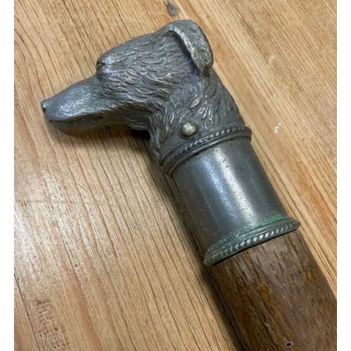 35 - A 20th century dogs head walking stick, cast metal handle as a Terrier, tapering shaft, 89.5cm long