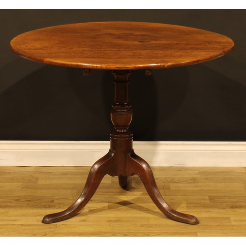 1536 - A George III oak tripod occasional table, circular tilting top, turned column, cabriole legs, pad fe... 