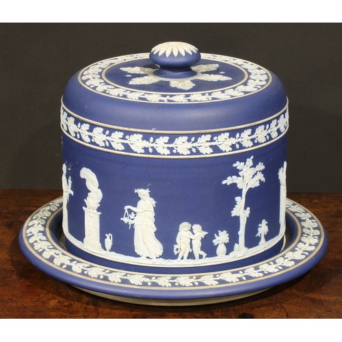 86 - A Wedgwood Jasperware cheese dome, sprigged in white after the antique, within bands of fruiting oak... 