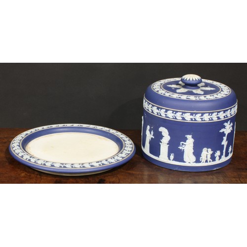 86 - A Wedgwood Jasperware cheese dome, sprigged in white after the antique, within bands of fruiting oak... 