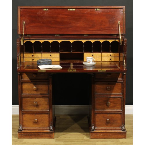 1481 - A Victorian mahogany secretaire kneehole desk, hinged top and fall front enclosing a tooled and gilt... 