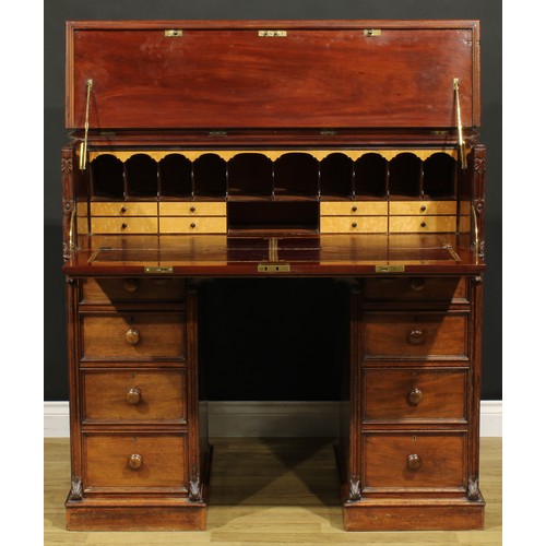 1481 - A Victorian mahogany secretaire kneehole desk, hinged top and fall front enclosing a tooled and gilt... 