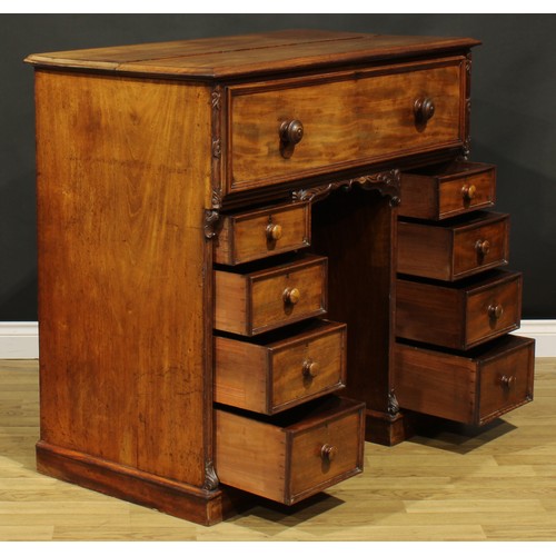 1481 - A Victorian mahogany secretaire kneehole desk, hinged top and fall front enclosing a tooled and gilt... 