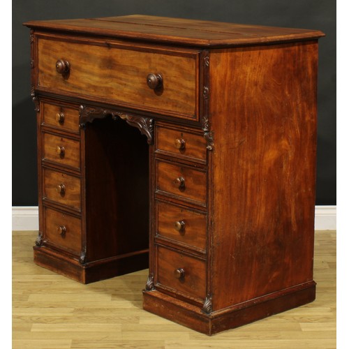 1481 - A Victorian mahogany secretaire kneehole desk, hinged top and fall front enclosing a tooled and gilt... 