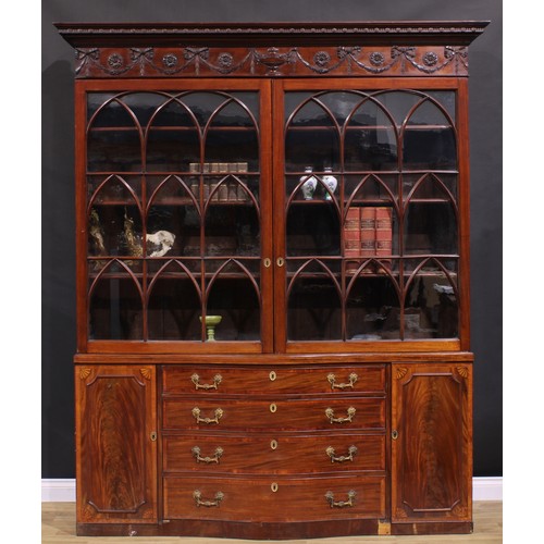 1282 - A 19th century Adam Revival mahogany library bookcase, outswept cornice above a deep frieze carved a... 