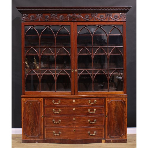 1282 - A 19th century Adam Revival mahogany library bookcase, outswept cornice above a deep frieze carved a... 