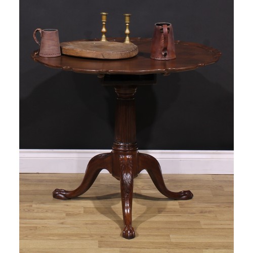 1256 - A 19th century mahogany tripod occasional table, pie-crust top, reeded spreading cylindrical column,... 