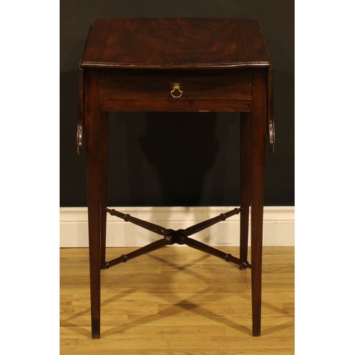 1302 - A George III mahogany butterfly Pembroke table, shaped top with fall leaves above a single frieze dr... 