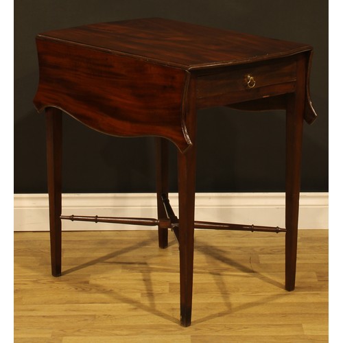 1302 - A George III mahogany butterfly Pembroke table, shaped top with fall leaves above a single frieze dr... 