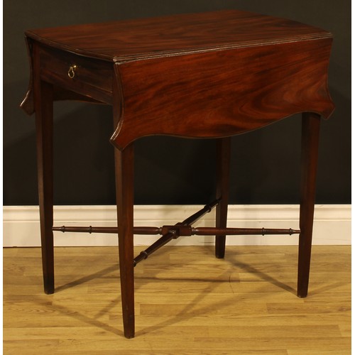 1302 - A George III mahogany butterfly Pembroke table, shaped top with fall leaves above a single frieze dr... 