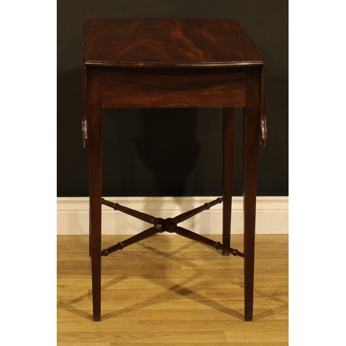 1302 - A George III mahogany butterfly Pembroke table, shaped top with fall leaves above a single frieze dr... 