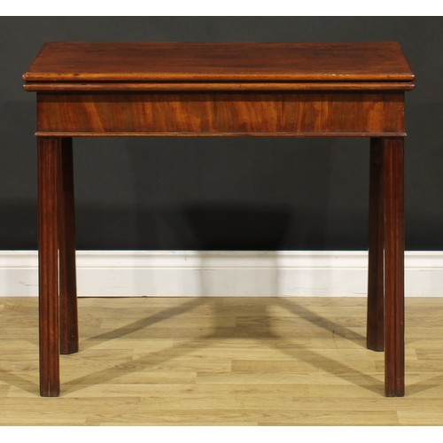 1303 - A George III mahogany card table, hinged top enclosing a baize lined playing surface, moulded intern... 