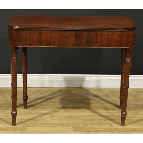 1253 - A 19th century mahogany tea table, hinged top with reeded edge above a deep frieze, ring-turned legs... 