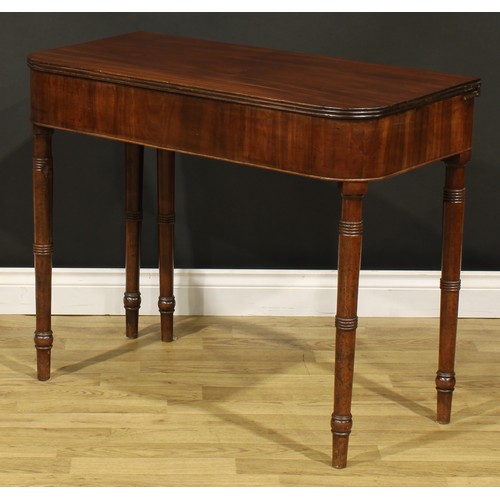 1253 - A 19th century mahogany tea table, hinged top with reeded edge above a deep frieze, ring-turned legs... 