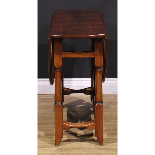 1278 - A 17th century style fruitwood gateleg table, oval top with fall leaves, turned and blocked supports... 