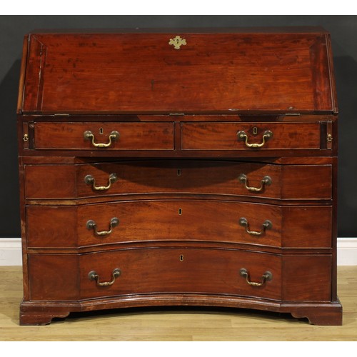 2201 - An unusual George III mahogany bureau, fall front enclosing a small door, small drawers, pigeonholes... 