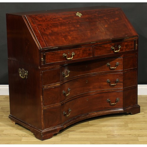 2201 - An unusual George III mahogany bureau, fall front enclosing a small door, small drawers, pigeonholes... 