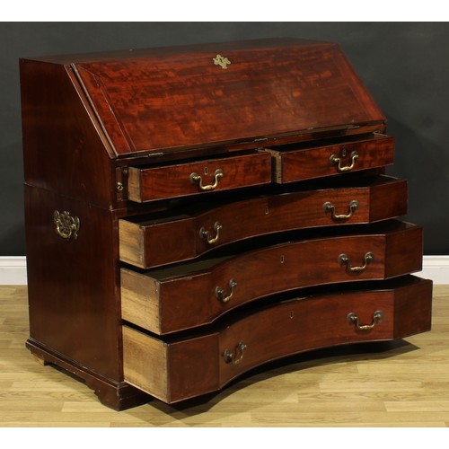 2201 - An unusual George III mahogany bureau, fall front enclosing a small door, small drawers, pigeonholes... 