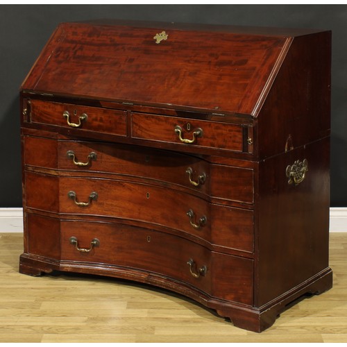 2201 - An unusual George III mahogany bureau, fall front enclosing a small door, small drawers, pigeonholes... 