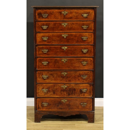 1565 - An unusual 18th century walnut and burr elm chest, of eight long drawers, brass swing handles, shape... 